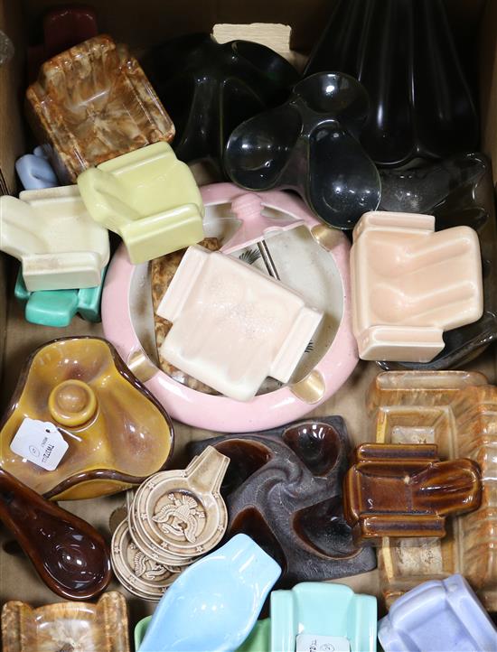 A collection of twenty nine ceramic pipe rests,